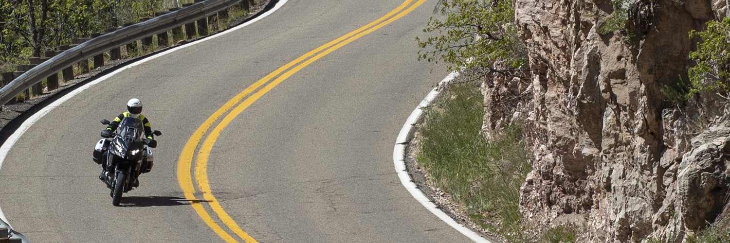 Rider on a curvy road, photo by Kevin Wing