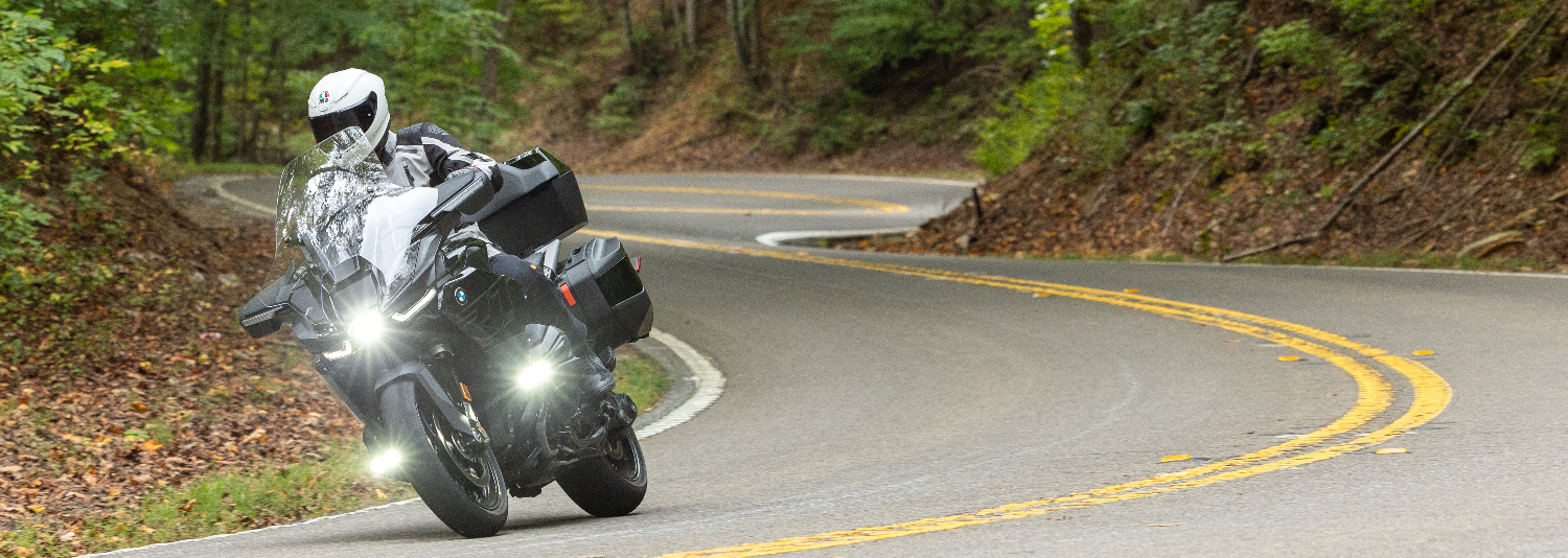 Riding a black BMW R 1300 RT touring motorcycle on a curving road in the northern Georgia mountains